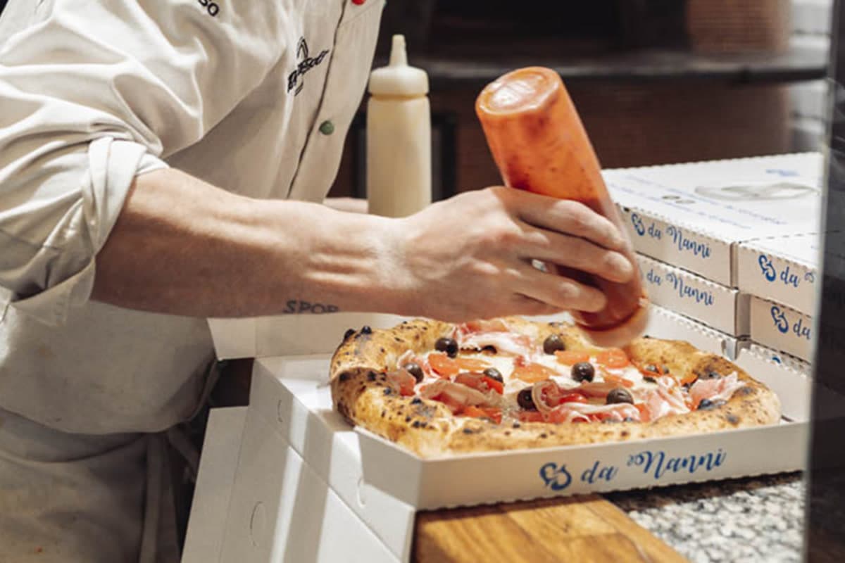 Neapolitan pizza in its Da Nanni takeaway box